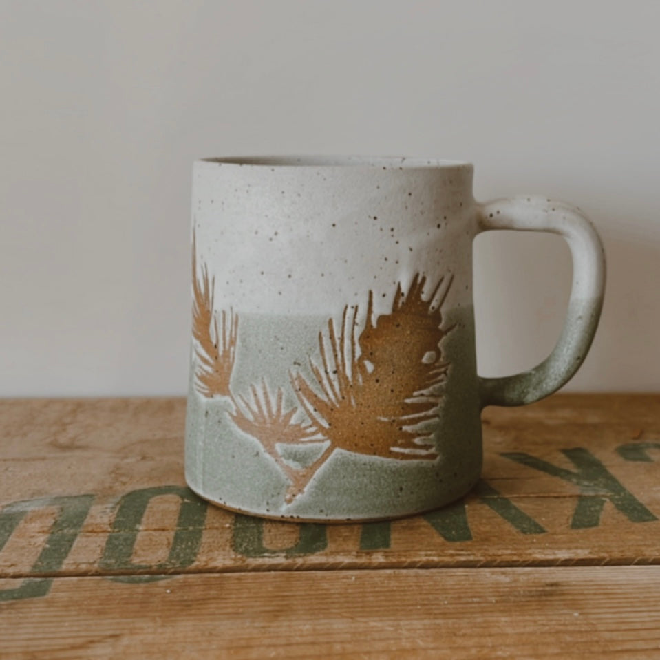 Winter Pine Boughs Mug in Black, Deep Evergreen, and Sand and Sage Glaze