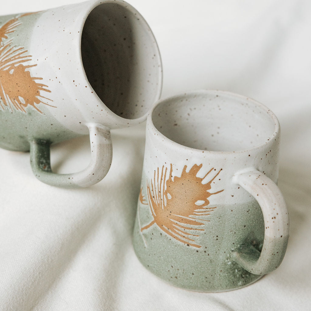 Winter Pine Boughs Mug in Black, Deep Evergreen, and Sand and Sage Glaze