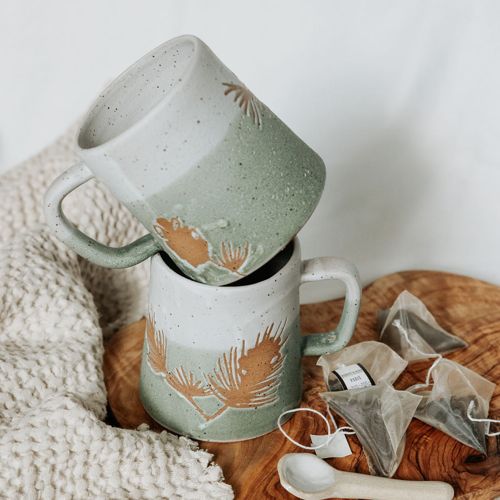 Winter Pine Boughs Mug in Black, Deep Evergreen, and Sand and Sage Glaze