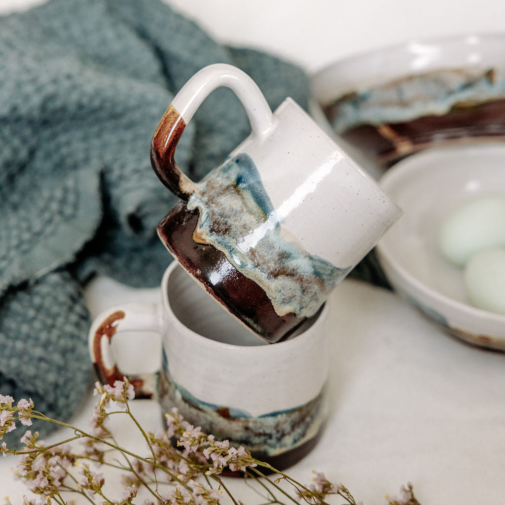 White, brown, and blue mug with local Whitemouth clay